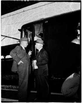 Durban, 24 November 1955. Minister Schoeman in conversation outside electrical locomotive.