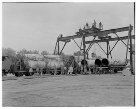 Vereeniging, May 1946. Loading large pipes onto train.