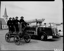 Worcester, 1960. Fire brigade posing at old fire truck from 1877 and a Dennis fire engine.