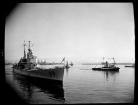 Cape Town, 17 February 1947. 'HMS Vanguard' in Table Bay with SAR tugs in attendance.