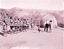 "Pietermaritzburg district, 1968. Tourists with group of traditional dancers."