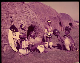 Zululand. Men and boys at traditional hut.