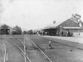 Cookhouse, 1897. Train in station.