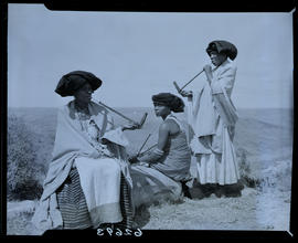 Transkei, 1954. Three women smoking pipes.