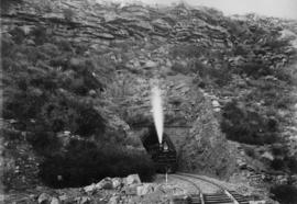 Hex River Mountains, 1895. Cape 4th Class Stephensons  locomotive emerging from tunnel. (EH Short)