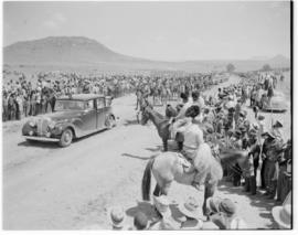 Basutoland, 11 March 1947. Mounted guard and royal cars of the royal procession.
