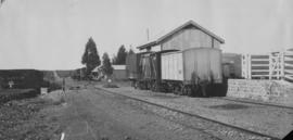 Kleinpoort, 1895. Goods wagons at loading ramp. (EH Short)