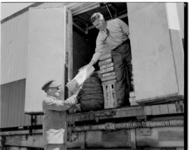 
Food supplies being loaded into a refrigerator van of the Pilot Train.
