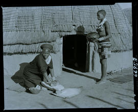 Zululand, 1957. Zulu woman grinding maize.