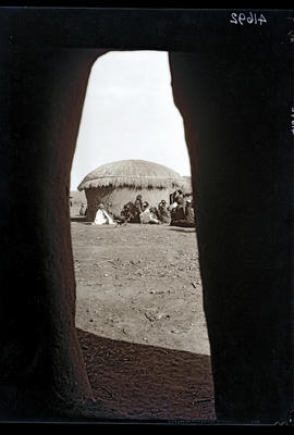 Transkei, 1932. Group of the Bomvaan tribe outside hut.