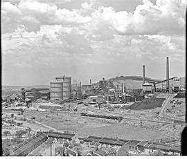 Pretoria, 1946. View of Iscor steel plant with SAR Class 19D hauling freight train in foreground.