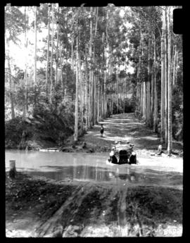 Round in Nine Tours - motor car fording river.