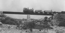 South-West Africa. DSWA Class Ha No 29 with construction train on bridge between Grootfontein and...