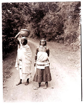 Transkei, 1940. Two women in road.