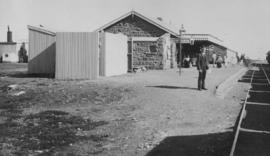 Belmont, 1895. Station building with railwayman posing in the foreground. (EH Short)