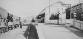 Matjiesfontein, 1895. Train at station building and platform. (EH Short)