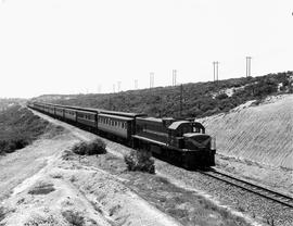 Port Elizabeth district, 1968. SAR Class 33-000 with passenger train descending the Zwartkops Ban...