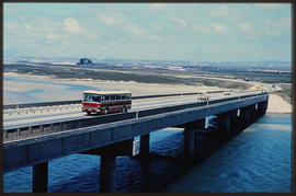 Port Elizabeth, 1968. SAR Mercedes Benz tour bus on bridge over Swartkops River. SAS.