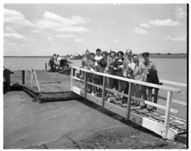 Vaal Dam, circa 1949. Arrival of BOAC flying boat Solent G-AKNS. Passengers on gangplank from jetty.