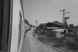 Akko, Israel, 1989. Israel State Railways passenger train, headed by a Class T44 diesel locomotiv...