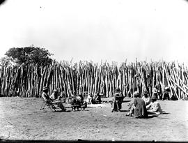 Khamastown, Bechuanaland. Khama and chiefs in palisade encampment.