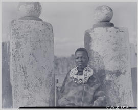 Pretoria district, 1952. Ndebele kraal, boy leaning on column.