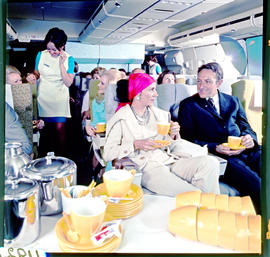 SAA Boeing 747 interior, hostess, passengers having tea.