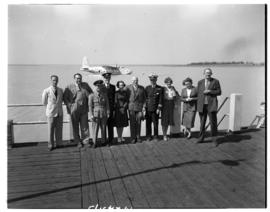 Vaal Dam, circa 1948. BOAC Solent flying boat G-AKCR 'Saint Andrew'. Group posing on jetty with a...