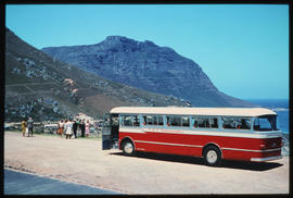 
SAR Mercedes Benz tour bus and passengers on shoreline.
