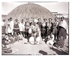 Natal, 1946. Zulu chief with his wives and children in front of hut.