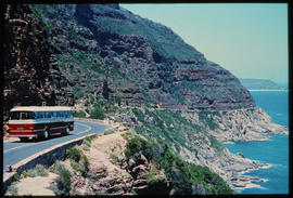 Cape Town. SAR Mercedes Benz tour bus on Chapmans Peak Drive.