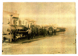 Piketberg. Group of men posing next to Cape 2-6-0 Baldwin locomotive, later SAR Class NG7 on the ...