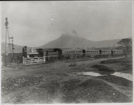 Cape Town district, circa 1890. CGR 3rd Class No 102, built in 1889, with mail train on the way t...