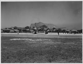 Cape Town. SAA Douglas DC-4 ZS-AUA 'Tafelberg' on runway with Table Mountain as background.