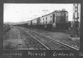 Estcourt district, circa 1925. Three electrical locomotives with train passing through Lowlands s...