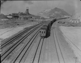 Johannesburg, 1939. SAR Class EMU with suburban train amidst mine dumps.