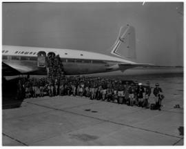 July 1963. Departure of Boy Scouts on chartertered SAA Douglas DC-7B ZS-DKG 'Chapman'.