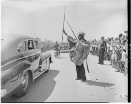 Port Elizabeth, 27 February 1947. Royal family in open car given a traditional greeting as they p...