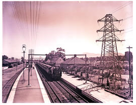 Paarl, 1952. SAR Class 15F with main line passenger trains at Huguenot railway station.