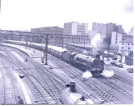 Johannesburg, 1946. SAR Class 15F departing Park Station with Blue Train.