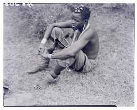 Transkei, 1940. Young man sitting on ground.