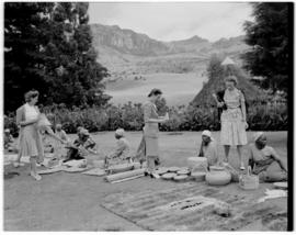 Royal Natal National Park, Drakensberg, 14 to 16 March 1947. Women sitting on lawn selling woven ...