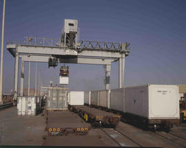 Johannesburg, 1983. Container being loaded onto train at City Deep container depot.