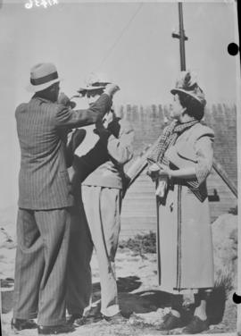 Cape Town, 21 April 1947. King George VI and Queen Elizabeth on Table Mountain adjusting the hat ...