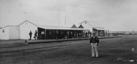 Mafeking, 1895. Station building with stationmaster in the foreground. (EH Short)