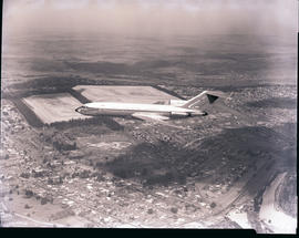 "Johannesburg 1966. SAA Boeing 727 ZS-DYN 'Limpopo' in flight over mine dumps."
