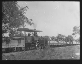 Dutton Road-rail RR1155 tractor with goods wagons.