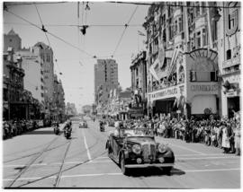 Durban, 22 March 1947.  Royal family in motorcade through West Street past Cuthberts building and...