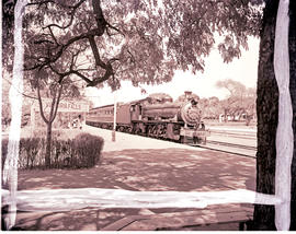 Victoria Falls, Southern Rhodesia, 1950. RR 12th Class No 182 with main line passenger train.