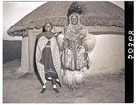 Natal, 1946. Zulu chief with first wife in front of hut.